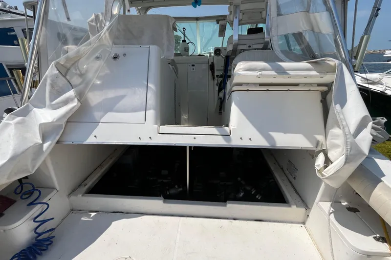 Slide: The Image of 2001 Rampage Express 30 Open boat interior with open engine compartment. - 58