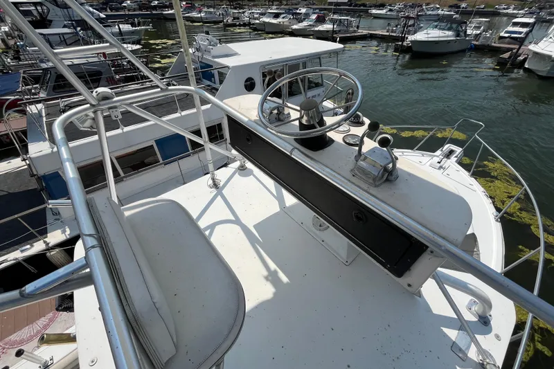 Slide: The Image of 2001 Rampage Express 30 Open boat helm with marina view in background. - 6