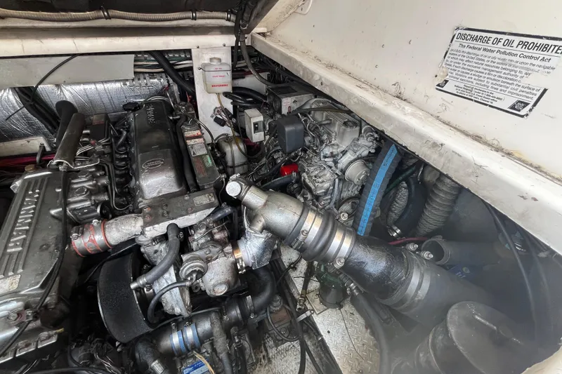 Slide: The Image of Engine compartment of a 2001 Rampage Express 30 Open boat, showcasing mechanical components. - 61