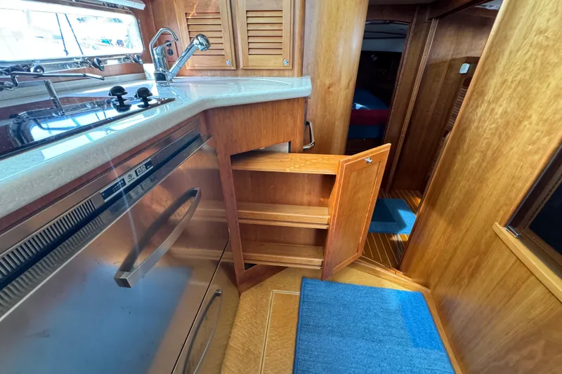 Slide: The Image of 2016 Sabre Craft Salon Express interior with wooden cabinetry and modern kitchen amenities. - 12