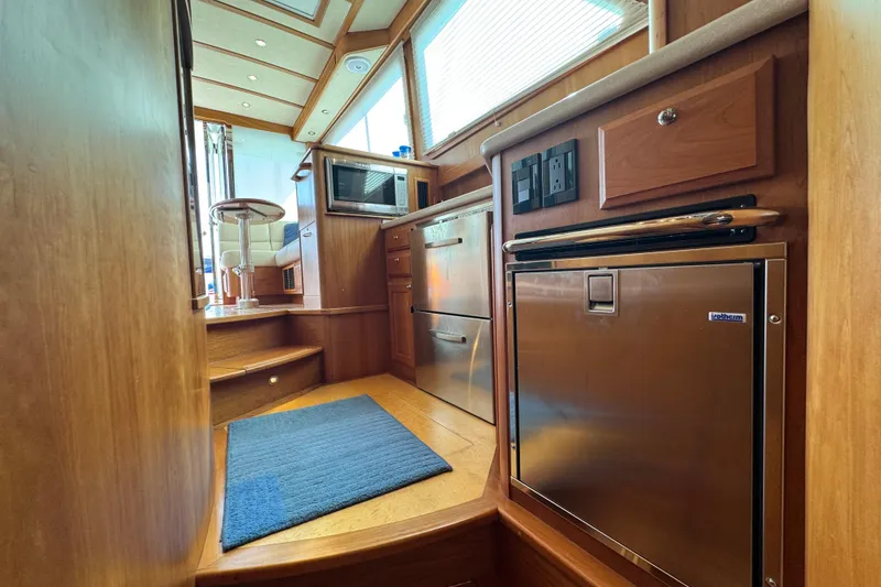 Slide: The Image of Interior of 2016 Sabre Craft Salon Express yacht with modern kitchen amenities. - 13