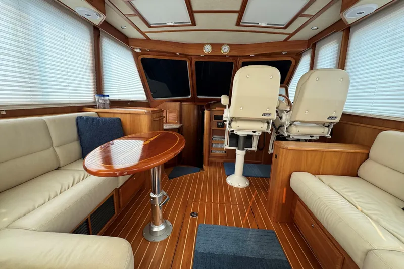 Slide: The Image of Luxurious interior of 2016 Sabre Salon Express yacht with plush seating and wooden finishes. - 2