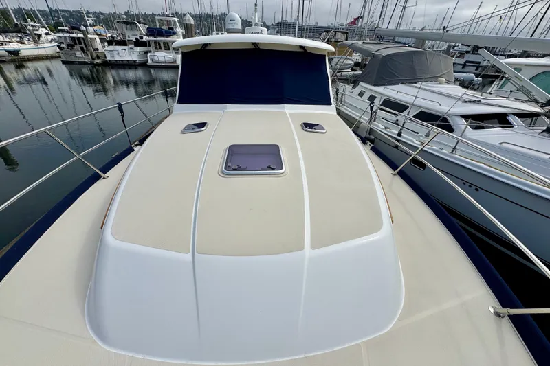 Slide: The Image of 2016 Sabre Craft Salon Express yacht docked at marina, surrounded by other boats. - 26