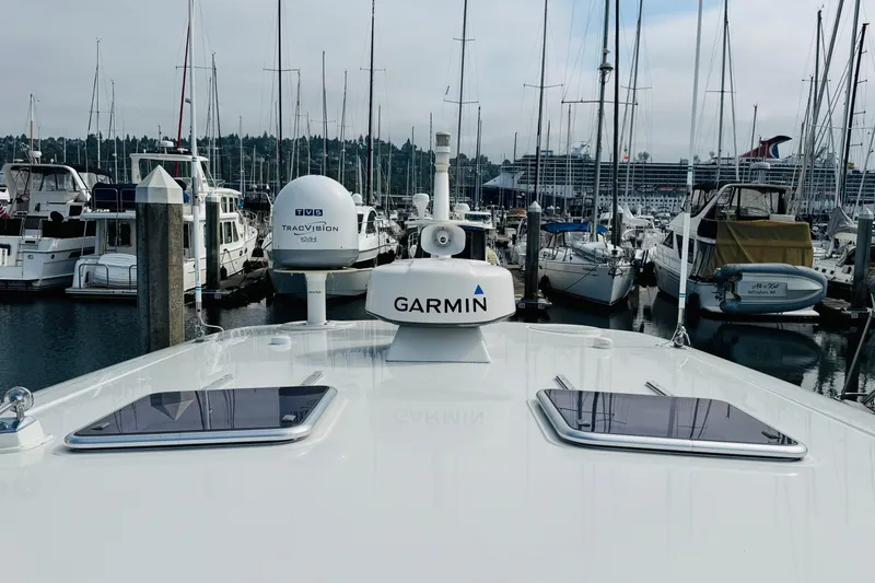 Slide: The Image of 2016 Sabre Craft Salon Express yacht docked in a marina with Garmin equipment. - 27