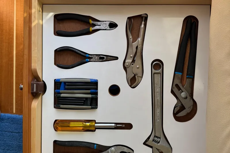 Slide: The Image of Tool drawer on 2016 Sabre Craft Salon Express, featuring pliers, wrenches, and screwdrivers. - 32