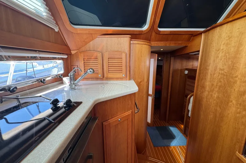 Slide: The Image of Interior of 2016 Sabre Craft Salon Express yacht with wooden cabinetry and modern kitchen. - 10