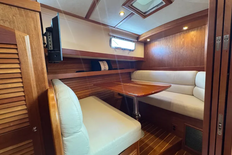 Slide: The Image of Luxurious 2016 Sabre Craft Salon Express interior with cozy seating and elegant wood finish. - 11