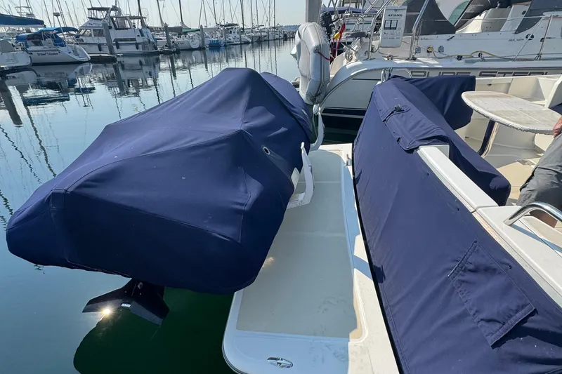 Slide: The Image of 2016 Sabre Craft Salon Express boat with covered seating at marina. - 25