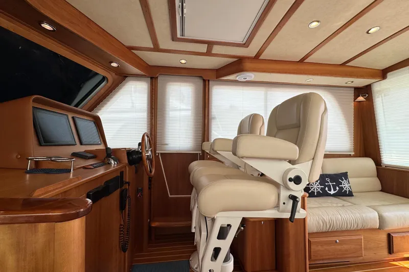 Slide: The Image of Luxurious 2016 Sabre Craft Salon Express interior with plush seating and elegant wood finishes. - 3