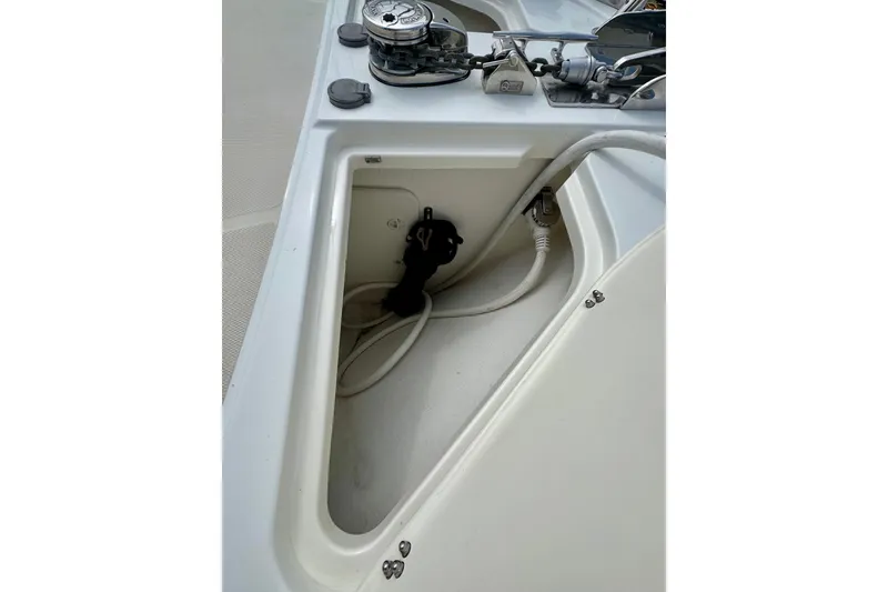 Slide: The Image of 2016 Sabre Craft Salon Express boat deck with anchor chain and storage compartment. - 30