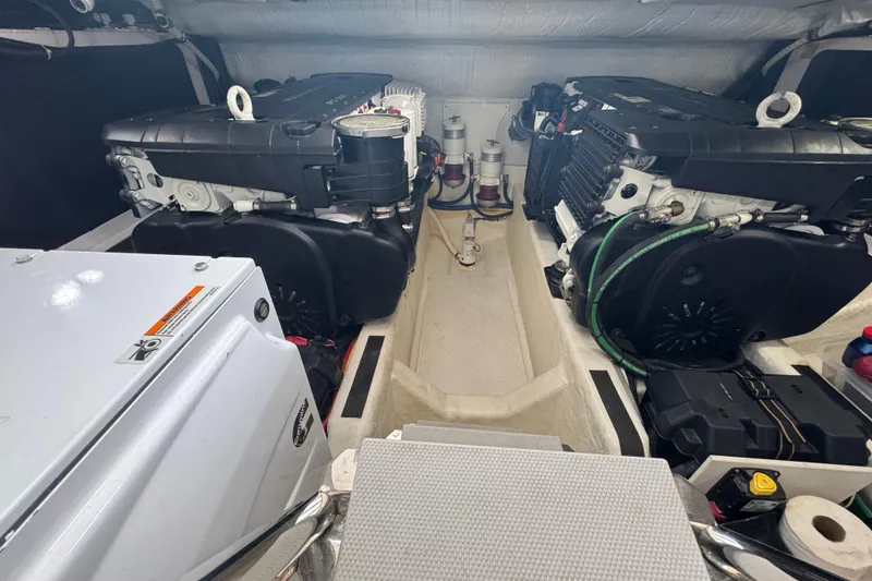 Slide: The Image of Engine room of a 2016 Sabre Craft Salon Express boat, showcasing dual engines. - 35