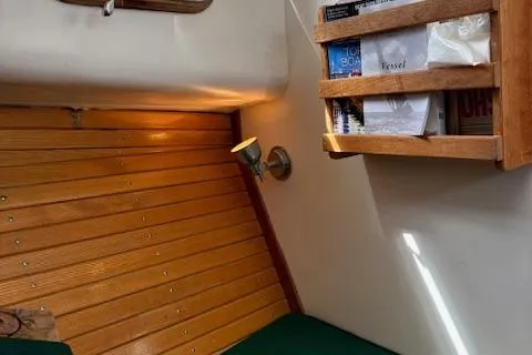 Slide: The Image of 1960 Dyer Hard Top interior with wooden paneling, bookshelf, and cozy lighting. - 15