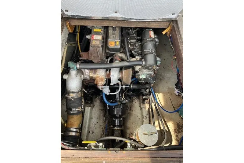 Slide: The Image of 1960 Dyer Hard Top boat engine compartment with visible mechanical components. - 19