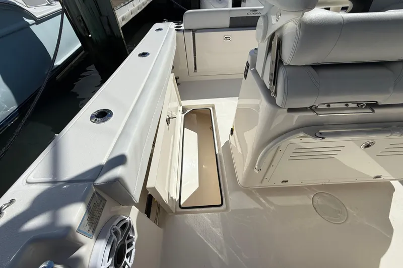 Slide: The Image of 2023 Cobia 280 Center Console boat interior with open storage compartment. - 26