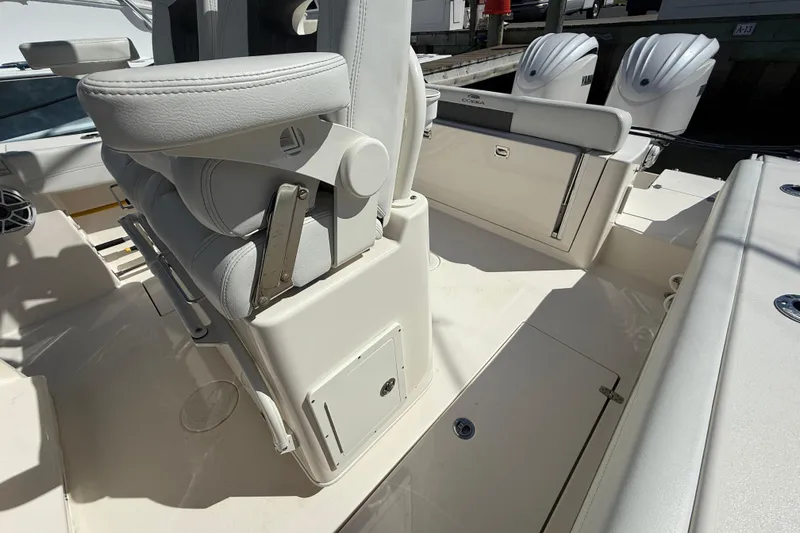 Slide: The Image of 2023 Cobia 280 Center Console boat interior with seating and storage compartments. - 28