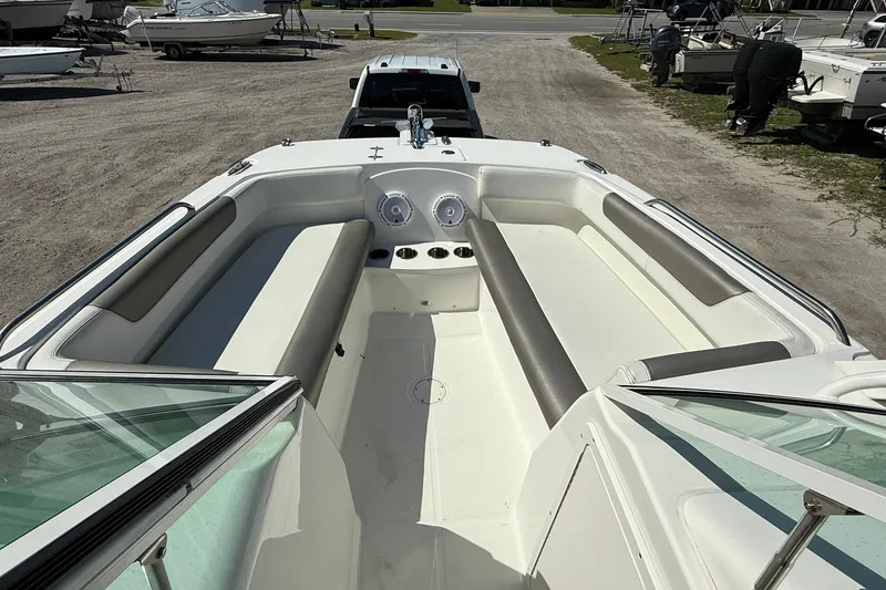 Slide: The Image of 2023 World Cat 230 DC boat interior with spacious seating and modern design. - 11