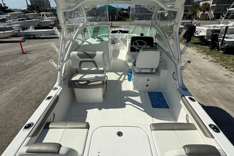 Slide: The Image of 2023 World Cat 230 DC boat interior with seating and steering console. - 9