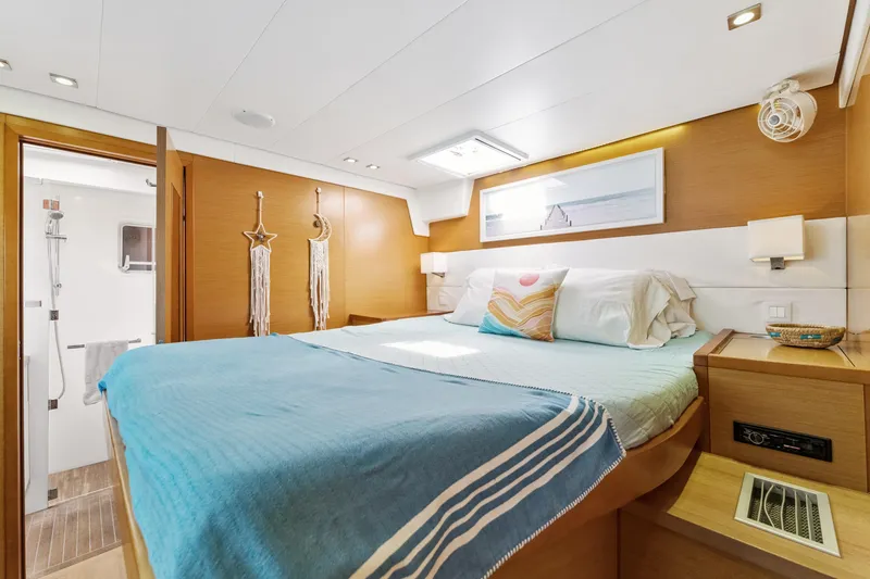 Slide: The Image of Luxurious bedroom interior of 2012 Lagoon 560 yacht with modern decor and ensuite bathroom. - 101