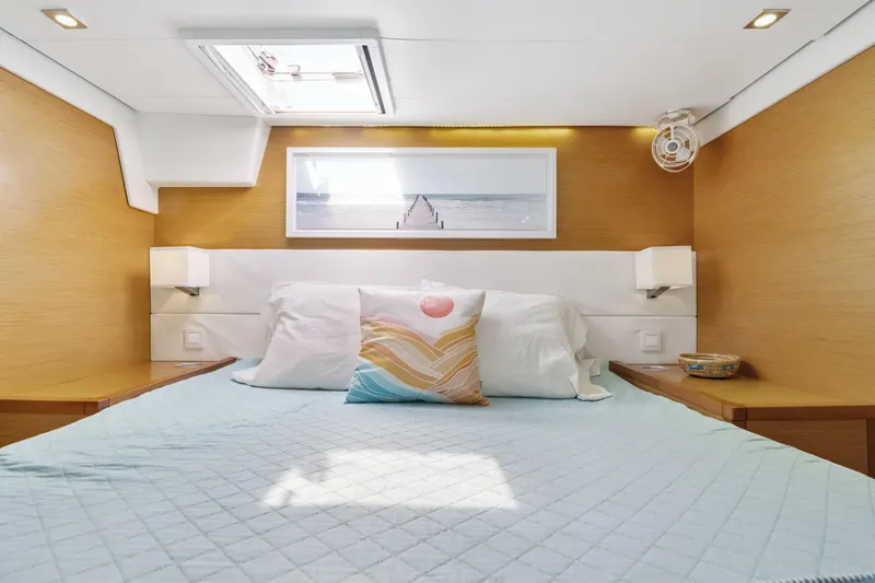 Slide: The Image of Luxurious cabin interior of 2012 Lagoon 560 yacht with cozy bedding and modern decor. - 102