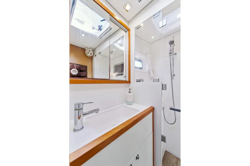 Slide: The Image of Luxurious bathroom in 2012 Lagoon 560 yacht with modern fixtures and skylight. - 103