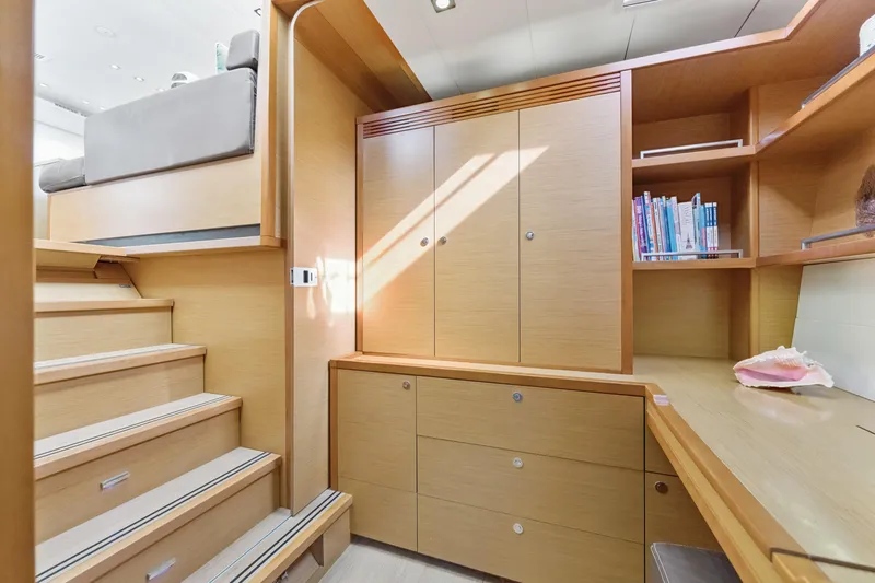 Slide: The Image of Luxurious interior of 2012 Lagoon 560 yacht with wooden cabinetry and staircase. - 107