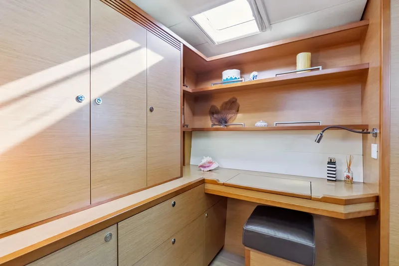 Slide: The Image of Luxurious interior of 2012 Lagoon 560 yacht with wooden cabinetry and modern decor. - 108