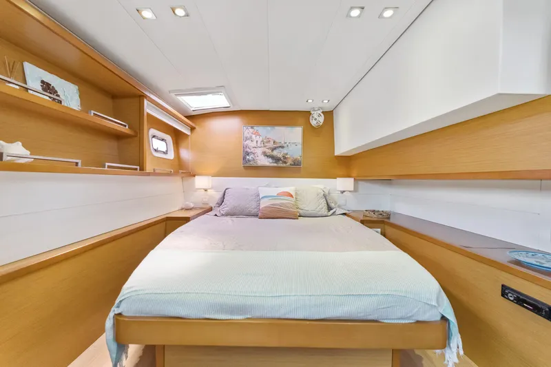 Slide: The Image of Luxurious cabin interior of 2012 Lagoon 560 yacht with cozy bed and modern decor. - 110