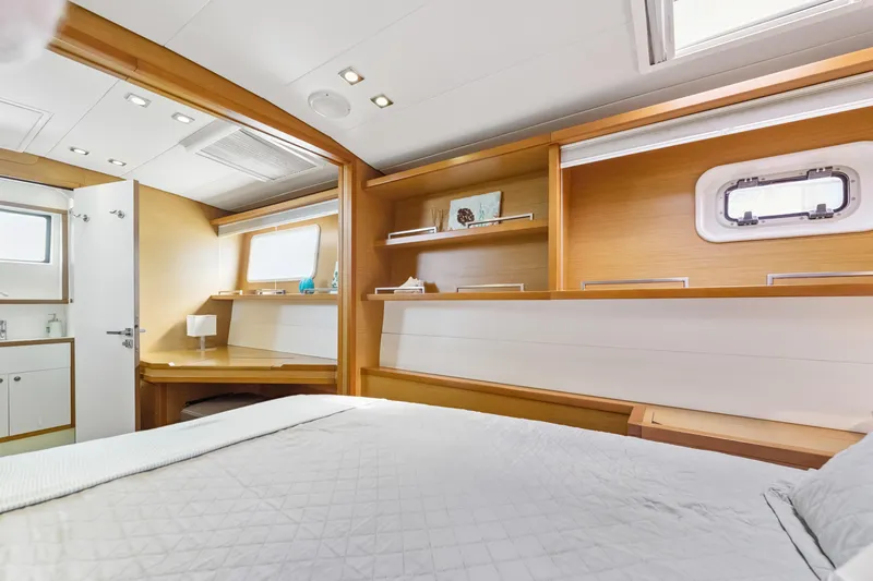Slide: The Image of Luxurious interior of 2012 Lagoon 560 yacht cabin with modern furnishings and natural light. - 111