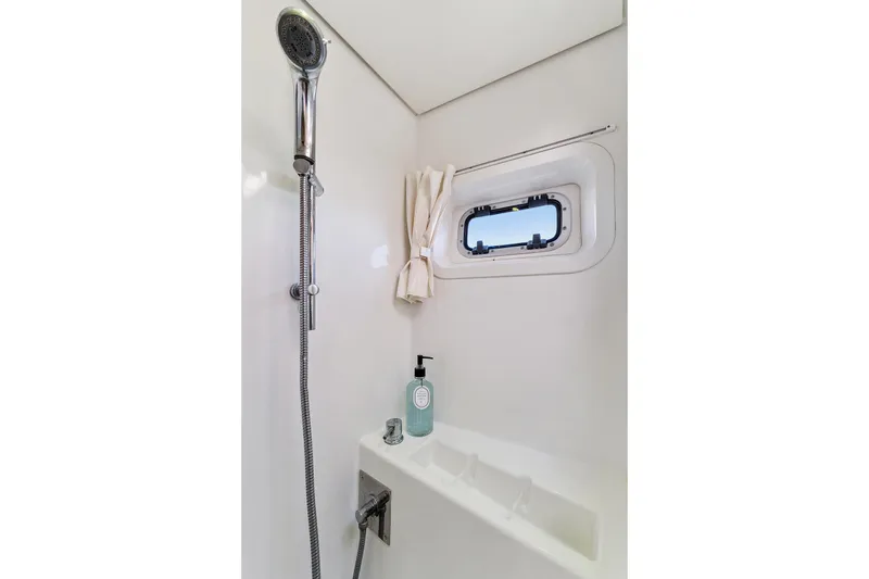 Slide: The Image of Luxurious shower area in 2012 Lagoon 560 yacht with window and modern fixtures. - 114