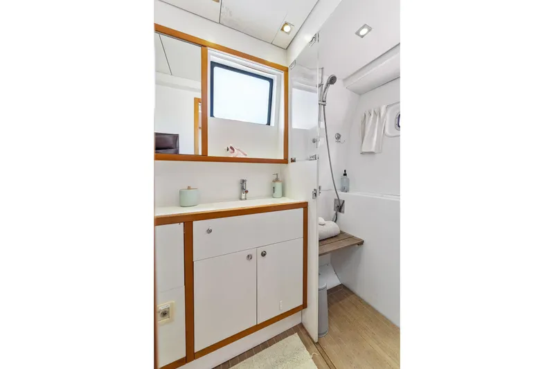 Slide: The Image of Luxurious bathroom in 2012 Lagoon 560 yacht with modern fixtures and wooden accents. - 115