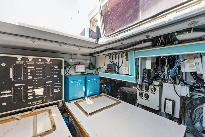 Slide: The Image of Electrical control room of a 2012 Lagoon 560 yacht, featuring panels and wiring. - 120
