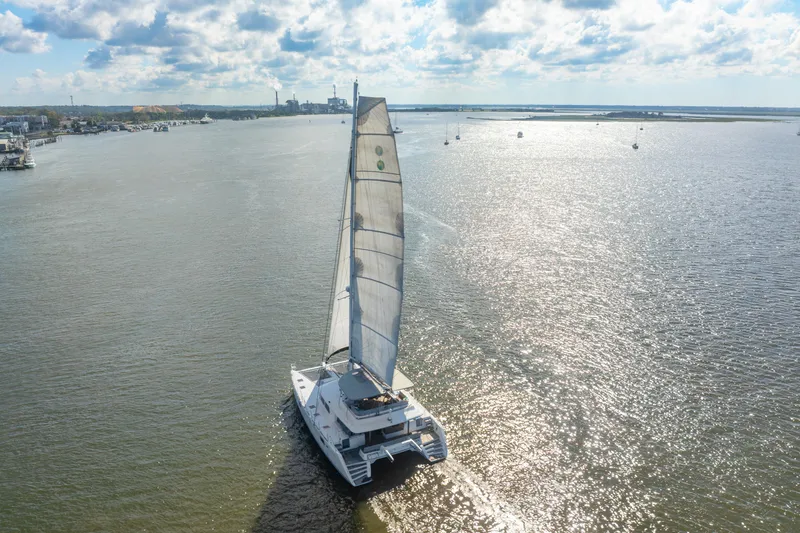 Slide: The Image of Sailing Lagoon 560 catamaran on a sunny day, 2012 model, cruising open waters. - 135