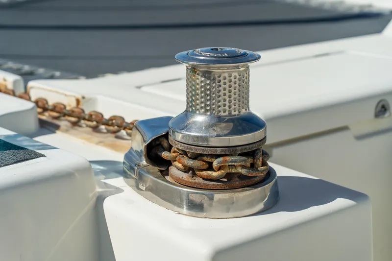 Slide: The Image of Close-up of a 2012 Lagoon 560 yacht's anchor windlass with rusty chain. - 18