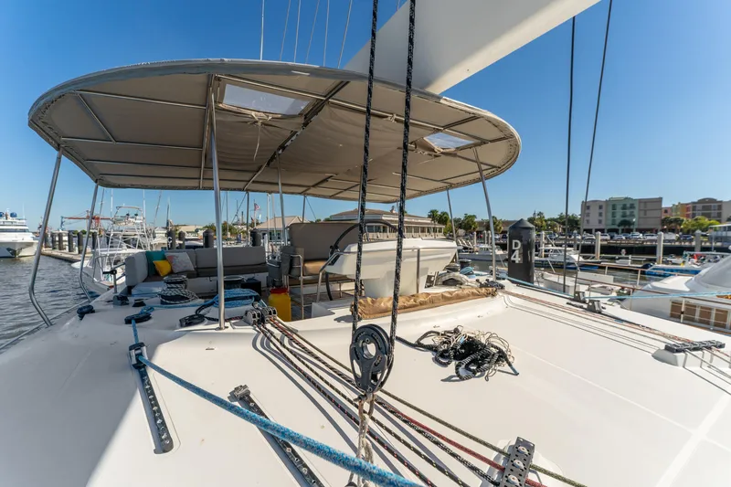 Slide: The Image of Lagoon 560 yacht, 2012 model, docked at marina with spacious deck and seating area. - 28