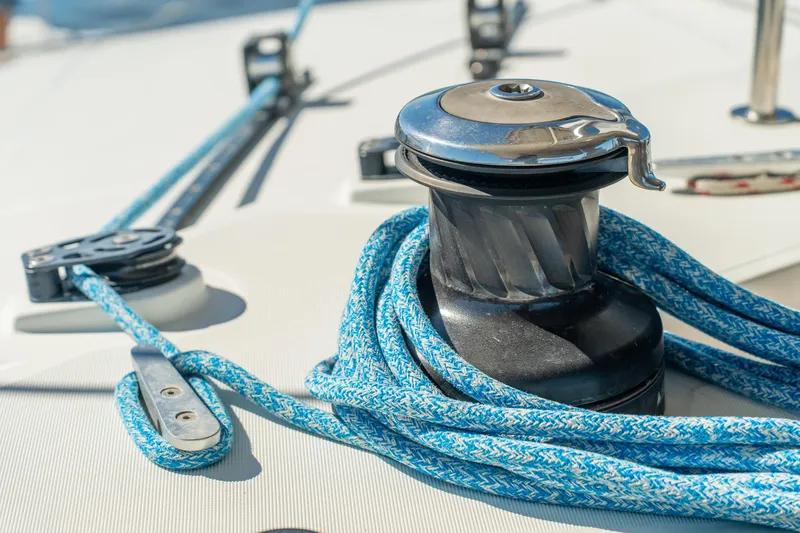 Slide: The Image of Close-up of a winch and blue rope on a 2012 Lagoon 560 yacht. - 29
