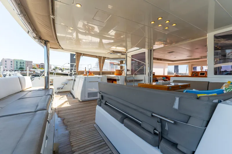 Slide: The Image of Luxurious 2012 Lagoon 560 yacht interior with spacious seating and modern amenities. - 31
