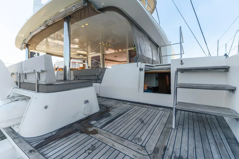 Slide: The Image of Luxurious 2012 Lagoon 560 yacht deck with seating and wooden flooring. - 32