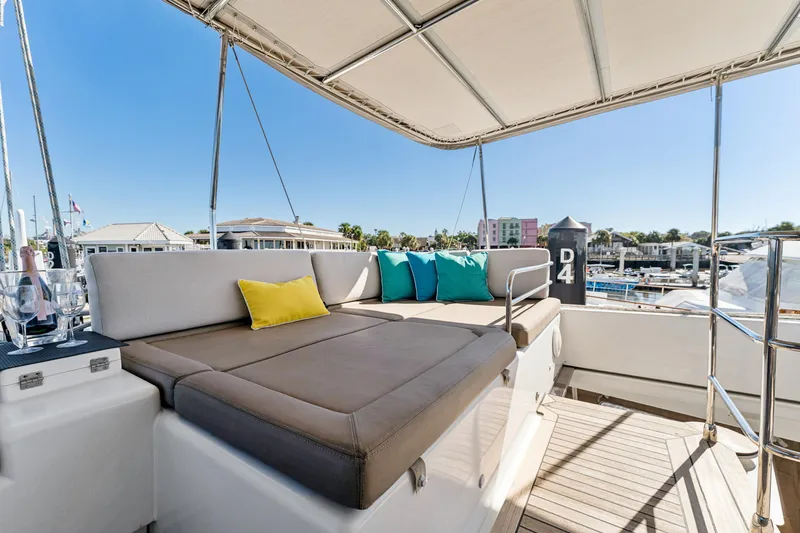 Slide: The Image of Luxurious 2012 Lagoon 560 yacht deck with comfortable seating and vibrant cushions. - 42