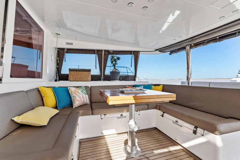 Slide: The Image of Luxurious Lagoon 560 yacht interior with cozy seating and vibrant cushions, 2012 model. - 49