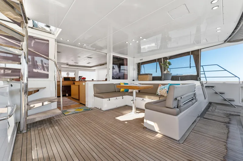 Slide: The Image of Spacious interior of 2012 Lagoon 560 yacht with modern seating and dining area. - 54