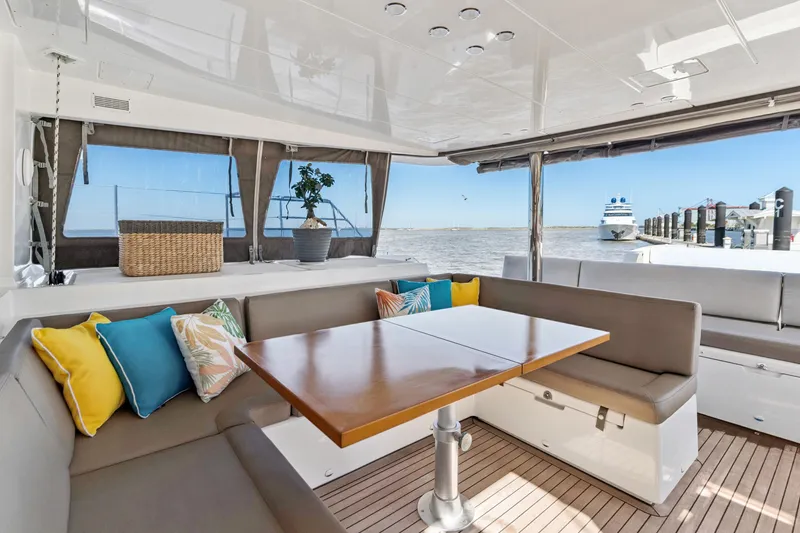 Slide: The Image of Luxurious Lagoon 560 yacht interior with colorful cushions and ocean view, 2012 model. - 55