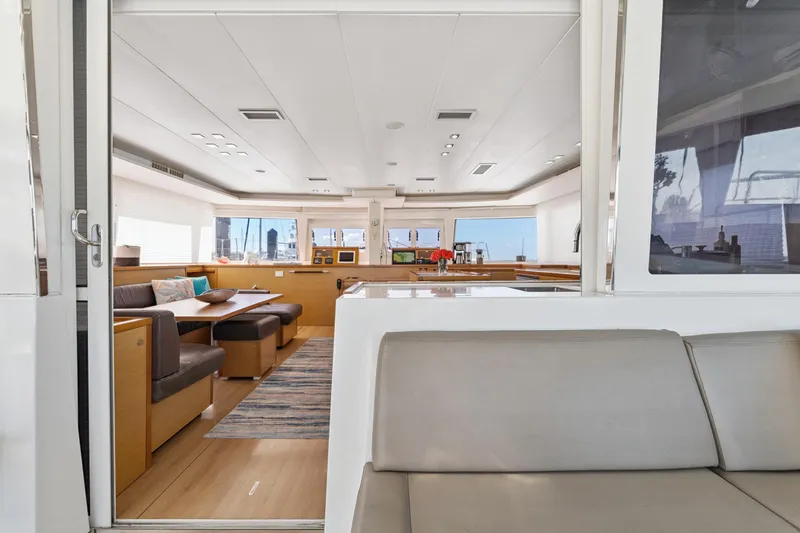 Slide: The Image of Luxurious interior of 2012 Lagoon 560 yacht with modern seating and panoramic windows. - 56