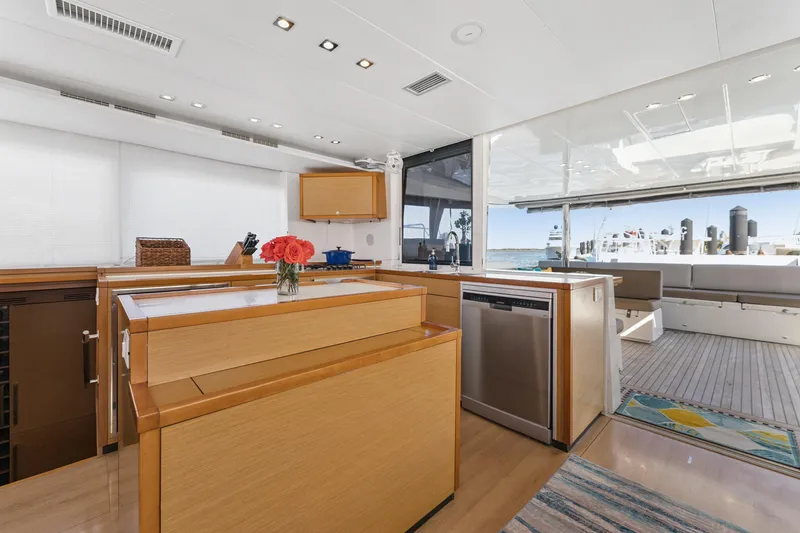 Slide: The Image of Luxurious interior of 2012 Lagoon 560 yacht with modern kitchen and spacious deck area. - 59