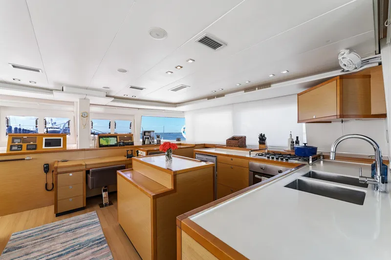 Slide: The Image of Luxurious interior of 2012 Lagoon 560 yacht featuring modern kitchen and navigation area. - 60