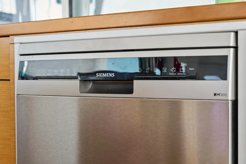 Slide: The Image of Siemens dishwasher in a 2012 Lagoon 560 yacht kitchen, featuring a sleek stainless steel design. - 63