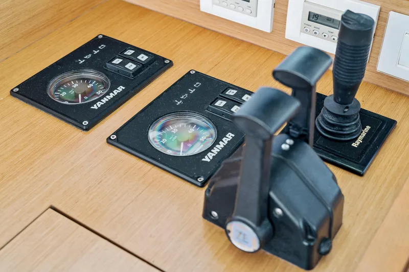 Slide: The Image of Control panel of a 2012 Lagoon 560 yacht with Yanmar gauges and Raymarine joystick. - 77