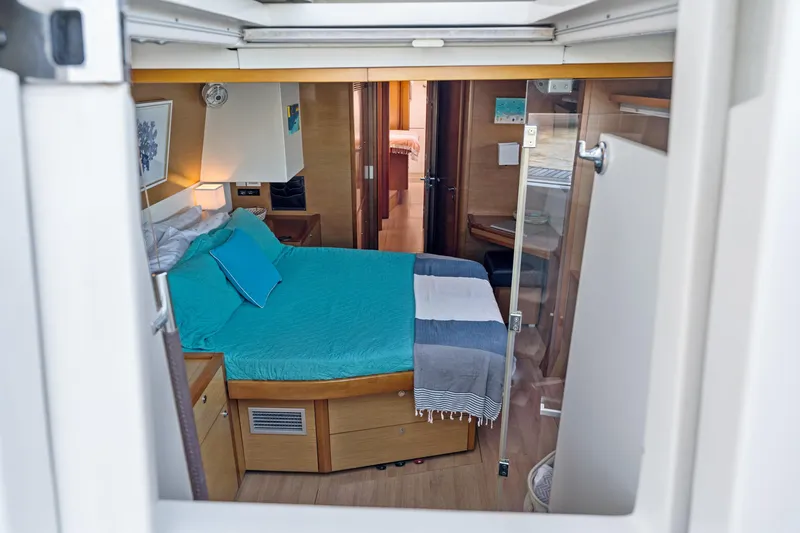 Slide: The Image of Interior cabin of 2012 Lagoon 560 yacht with cozy bed and modern decor. - 80