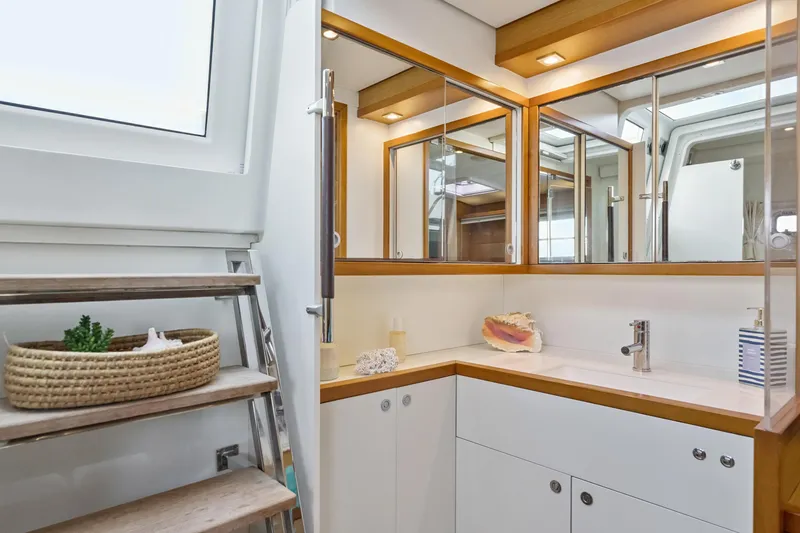 Slide: The Image of Luxurious bathroom interior of 2012 Lagoon 560 yacht with modern fixtures and wooden accents. - 87