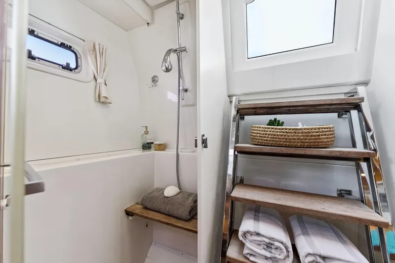 Slide: The Image of Luxurious bathroom in 2012 Lagoon 560 yacht with shower and wooden steps. - 88