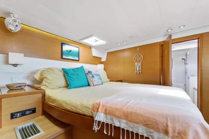 Slide: The Image of Luxurious bedroom interior of 2012 Lagoon 560 yacht with modern decor and cozy bedding. - 90